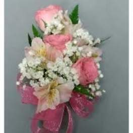 Pink and white floral corsage with ribbon