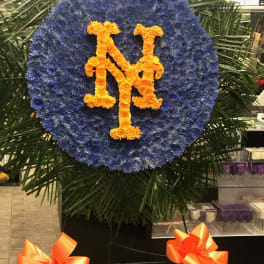 Large blue floral wreath with orange interlocking NY letters