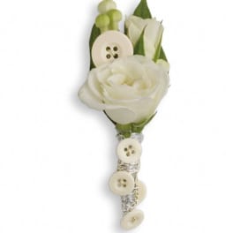 White rose boutonniere with cream buttons and silver wrap