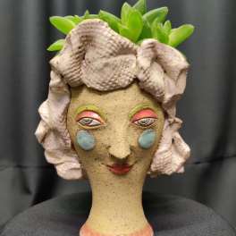 Locally handmade clay, potted succulent