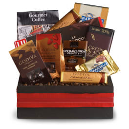 Gift box filled with assorted gourmet chocolate bars and coffee in a black container with red ribbon