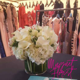 White floral arrangement in a clear glass vase