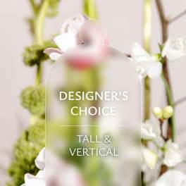 Tall floral arrangement with white and pale pink blooms