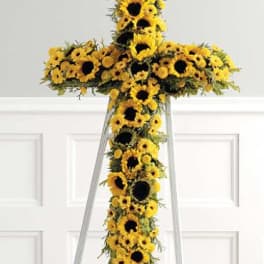 Sunflower cross arrangement on a stand
