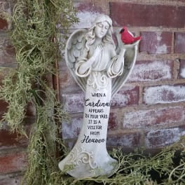 Angel figurine with a red cardinal and a memorial quote