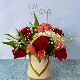 Rose arrangement in a heart vase with a rhinestone "Love" topper