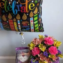 Birthday balloon with a flower bouquet and teddy bear gift box