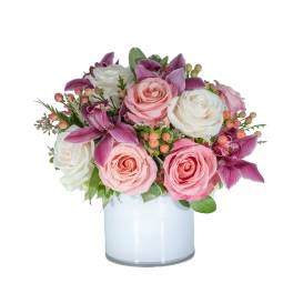 Pink and white roses with purple orchids in a glass vase