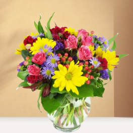 Colorful mixed bouquet in a clear glass vase