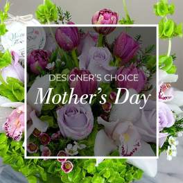 Bouquet of purple tulips, lavender roses, and white orchids
