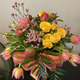 Peonies roses and tulips in a beautiful bubble bowl