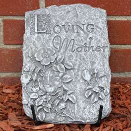 Decorative stone plaque reading "Loving Mother" with floral relief