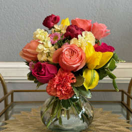 Colorful mixed bouquet in a clear glass vase