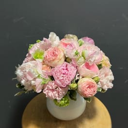 Pink and white mixed bouquet in a white vase