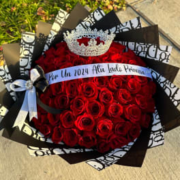 Bouquet of red roses with a silver crown and ribbon