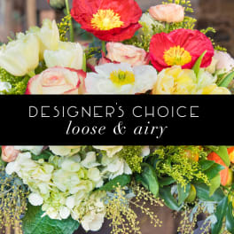 Loose mixed bouquet with poppies, roses, tulips, and hydrangeas