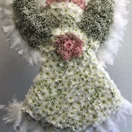Large floral standing spray shaped like an angel with pink roses and white flowers