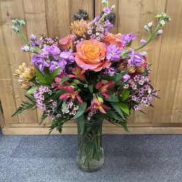 Colorful mixed bouquet in a clear glass vase