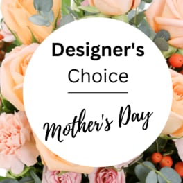 Peach and pink roses with eucalyptus around a Mother's Day label