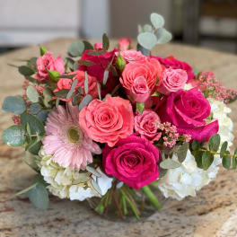 Pink and white rose bouquet with eucalyptus and a gerbera daisy