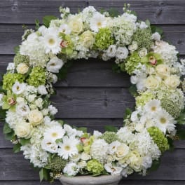 White and green floral wreath with roses and daisies