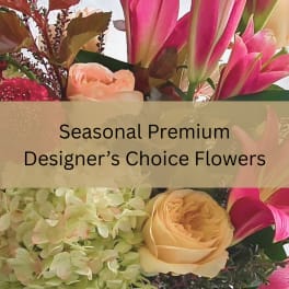 Pink lilies, peach roses and green hydrangeas with overlaid text reading Seasonal Premium Designer’s Choice Flowers.