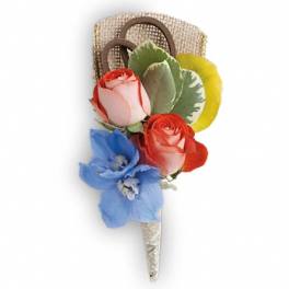 Small floral corsage with roses and a blue orchid