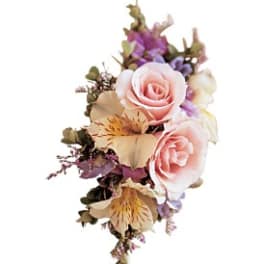 Pink roses with purple and cream flowers in a small bouquet