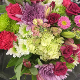 Mixed bouquet of pink roses, chrysanthemums, hydrangea, and lilies