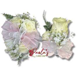 Two small bouquets of cream roses with pink ribbon bows