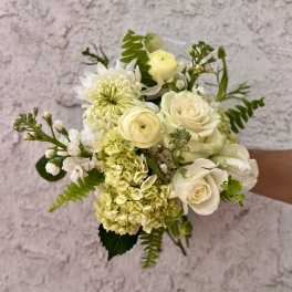White and pale yellow bouquet with roses, hydrangea, and chrysanthemum