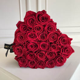 Bouquet of red roses wrapped in black ribbon