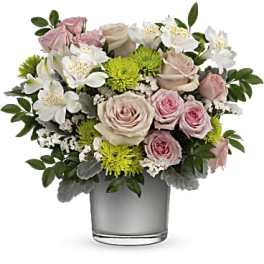 Pink and white roses with white alstroemeria in a glass vase