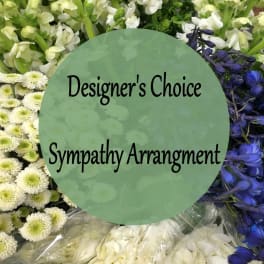 Sympathy arrangement with white and blue flowers