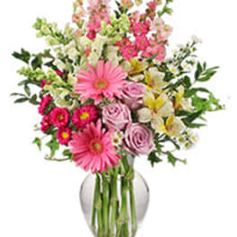 Pink and white mixed bouquet in a clear glass vase