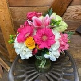 Pink and white mixed bouquet in a glass vase