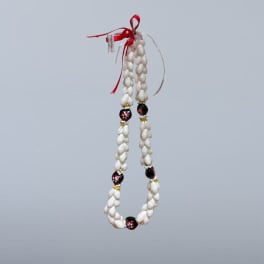 White shell garland with red ribbon and black floral beads