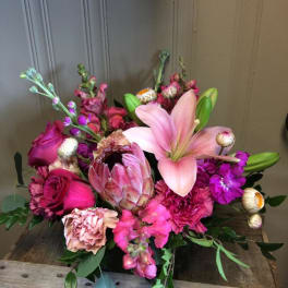 Pink lily and rose bouquet with protea and carnations