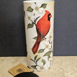Tall cylindrical vase with a red cardinal and white flowers