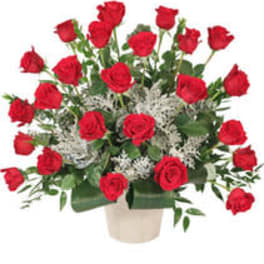 Bouquet of red roses in a beige vase