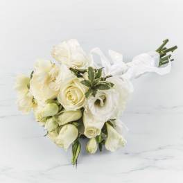 White rose and lisianthus bouquet tied with white ribbon