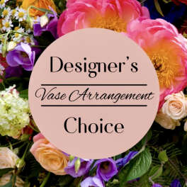 Mixed flowers around a circle reading Designer's Vase Arrangement Choice