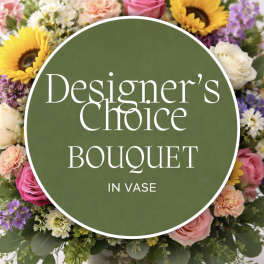 Mixed bouquet of sunflowers, roses, and other blooms in a clear vase with a text overlay.