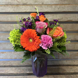 Sofia vase purple and orange flowers ( designer's choice of flowers)