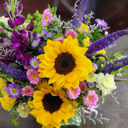Bouquet with sunflowers, purple spikes, and pink and lavender daisies