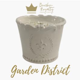 Cream ceramic candle jar with gold logo and text