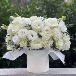 White rose and carnation bouquet in a white hatbox