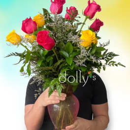 Bouquet of pink and yellow roses in a glass vase