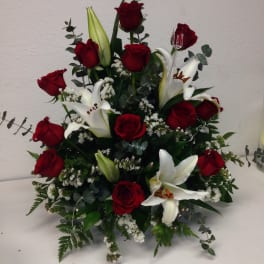 One dozen roses in any color with Lilly's