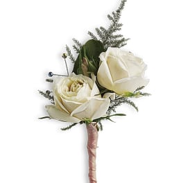 White rose boutonniere with greenery and small decorative beads
